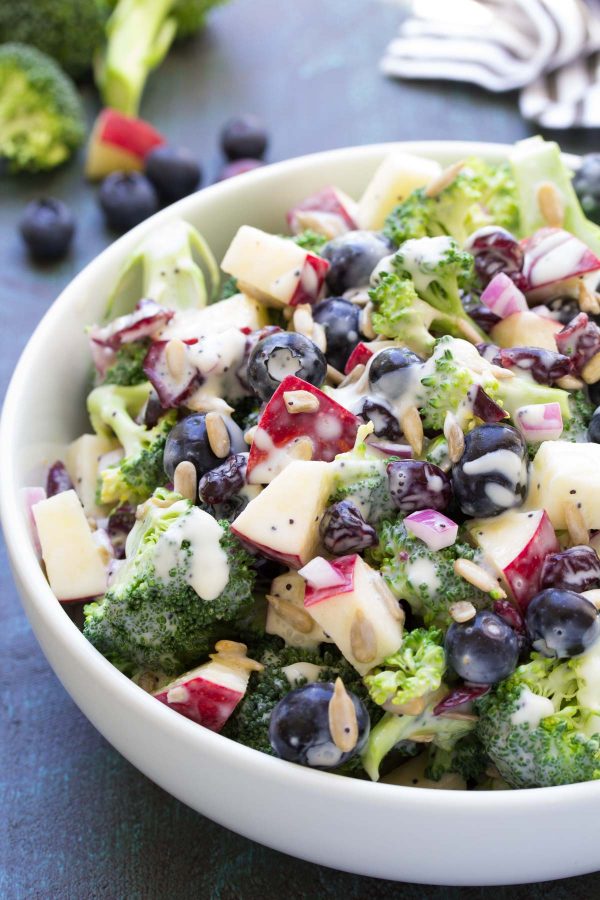 Best Ever No Mayo Broccoli Salad with Blueberries and Apple! This healthy and easy side dish has a creamy poppy seed dressing, cranberries, and sunflower seeds. It will be the hit of your summer BBQ or 4th of July party! kristineskitchenblog.com