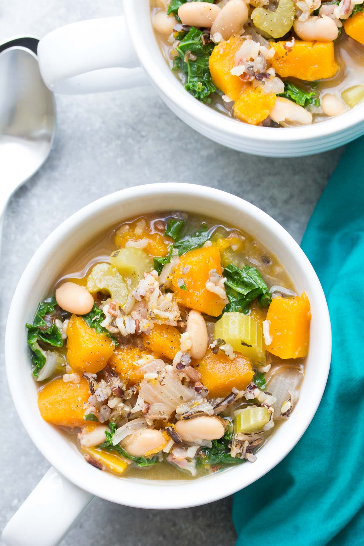 Slow Cooker Wild Rice Vegetable Soup - This healthy crock pot soup is great for meal prep lunches and dinners! With butternut squash and kale. Vegetarian & Vegan | www.kristineskitchenblog.com