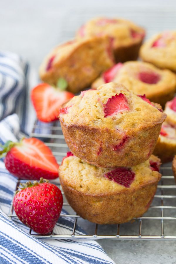 Make these healthy strawberry muffins to stock your freezer for quick breakfasts and snacks! This easy recipe can make strawberry banana muffins, strawberry applesauce muffins or strawberry yogurt muffins. Dairy-free and vegan options.