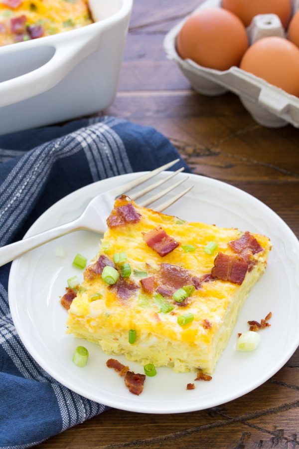 An easy breakfast casserole recipe with hashbrowns and bacon. Make ahead for an overnight egg casserole. Try sausage or ham instead of the bacon, use shredded hash browns or diced potatoes, and add your favorite kind of cheese!