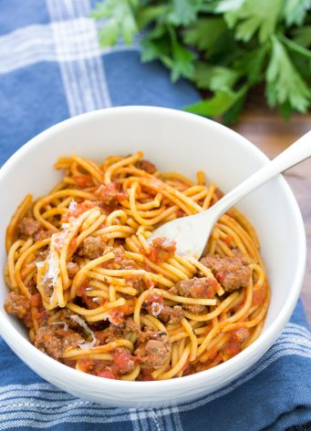 Easy Instant Pot Spaghetti is one of the best Instant Pot recipes for a fast family dinner! Everything cooks together in one pot: meat, noodles and sauce. Make this quick dinner with ground beef or turkey and whole wheat or white pasta.