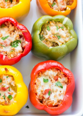 Stuffed bell peppers with rice, ground turkey or beef, tomato sauce and seasonings. These easy Italian stuffed peppers are a healthy meal that you can make ahead!