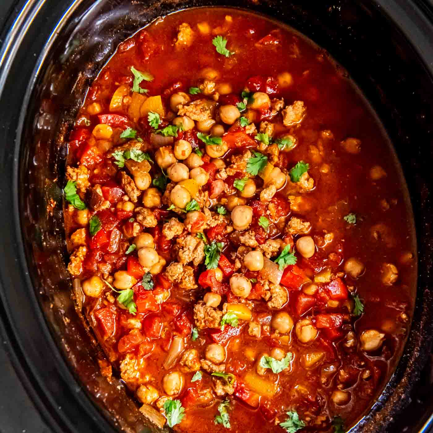 Turkey chickpea chili cooking in a slow cooker