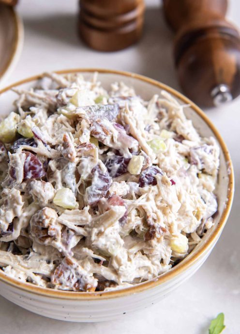 Chicken salad with grapes and pecans in a bowl.