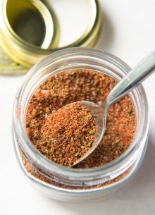 chicken seasoning in glass jar with spoon