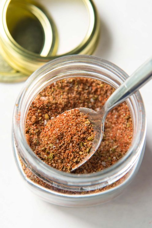 chicken seasoning in glass jar with spoon