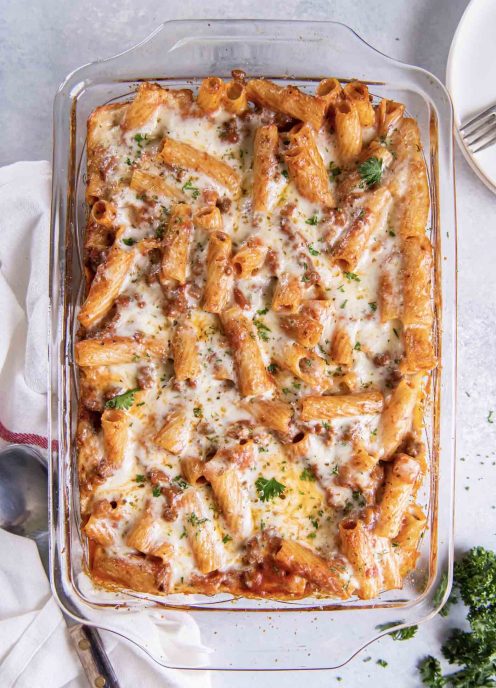 Baked rigatoni pasta in baking dish.