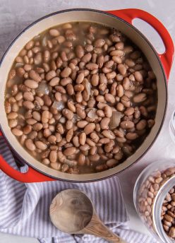 Cooked pinto beans in a Dutch oven pot.